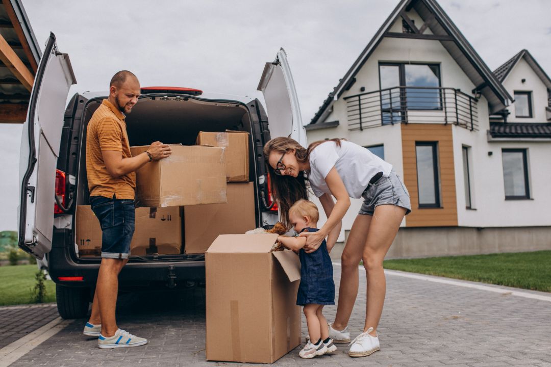 young-family-with-little-daughter-moving-into-new-house (1) Movers Remove Junk