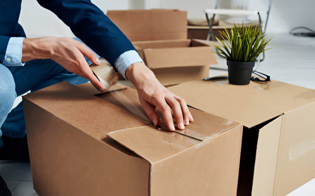 Man unpacking boxes new place emotions office manager