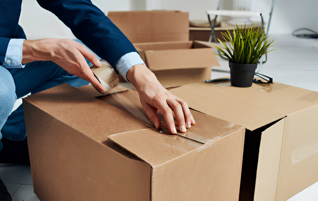 Man unpacking boxes new place emotions office manager
