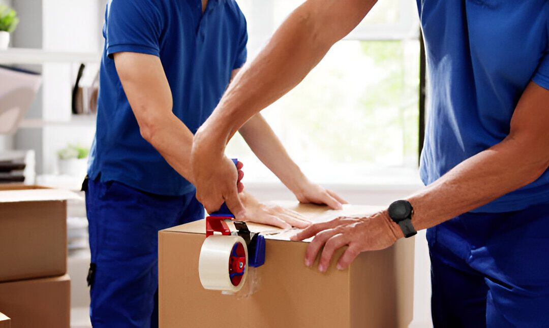 Professional movers carefully wrapping furniture in tape