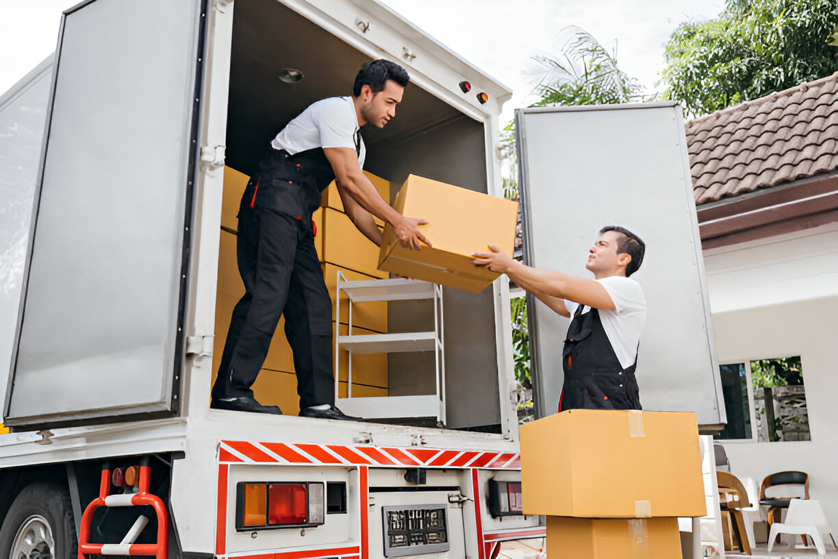 With smiling faces removal company workers efficiently unload boxes With smiling faces removal company workers efficiently unload boxes